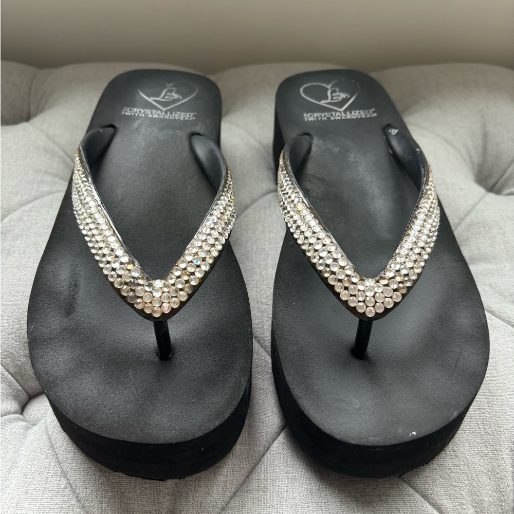 Lady Lanell’s crystallized with Swarovski flip flops. Black size 8.